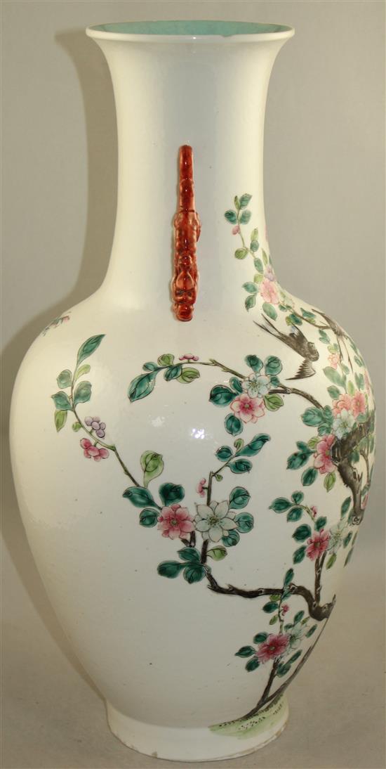 A large Chinese famille rose twin handled bottle vase, Qianlong seal mark, late 19th century, 54cm., foot ground off in manufacture